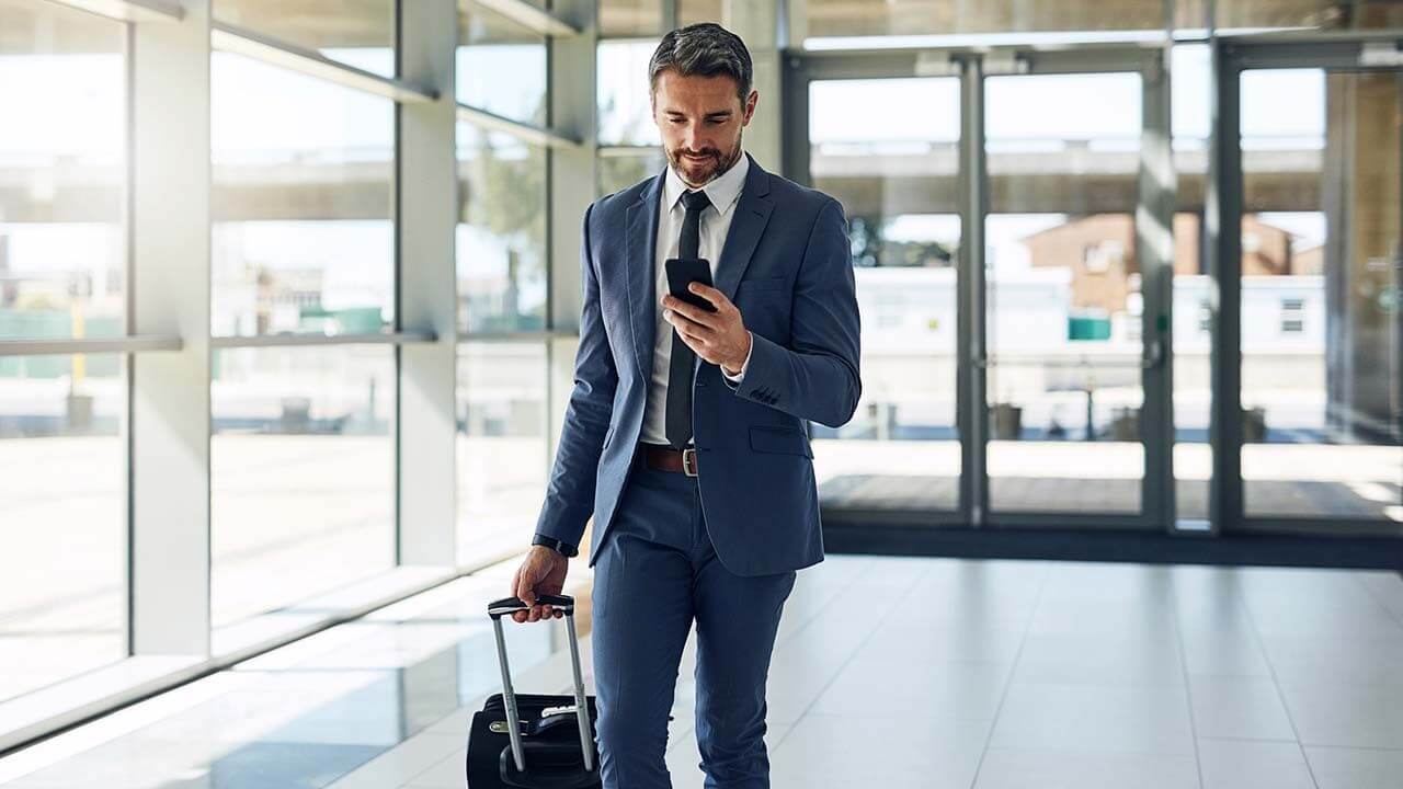 business travel businessman holding phone